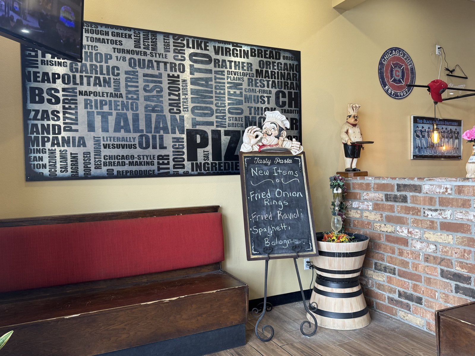 Scalisi's chalkboard of new items beside a red booth