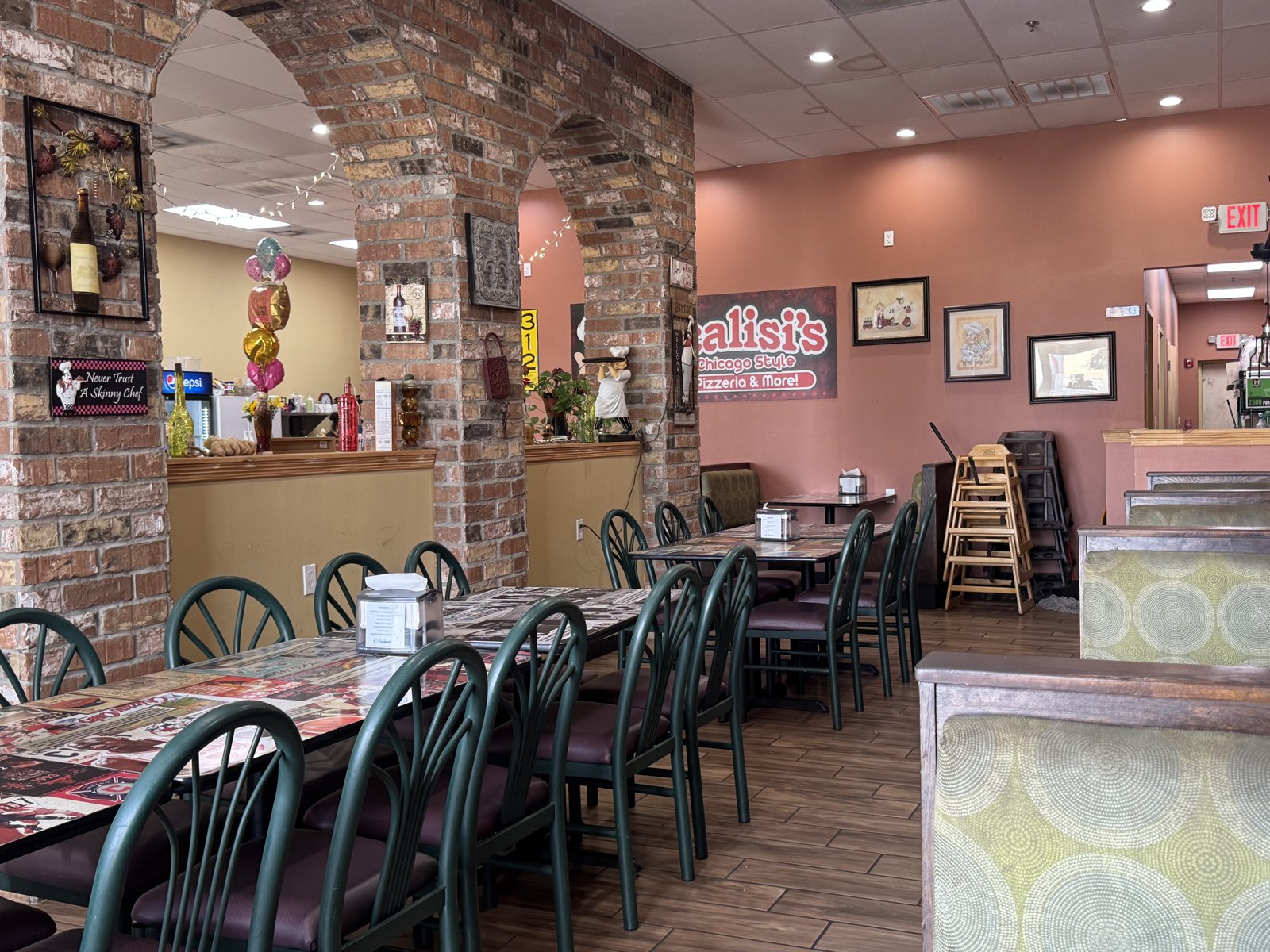 Brick arches and green chairs in Scalisi's dining room